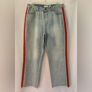 a loves a light blue Jean with red stripes on sides